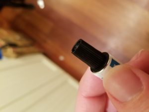 Hand holding tube of medicine 